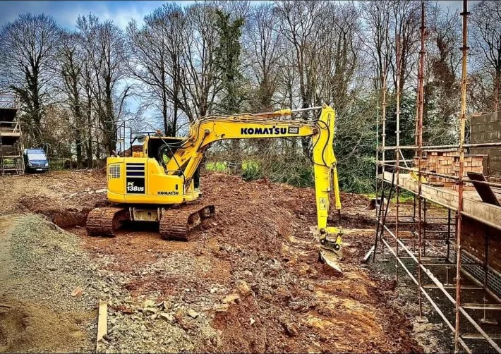Komatsu excavator carrying out ground preparation